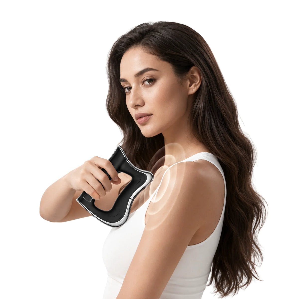 Woman using black massage gun on shoulder for muscle recovery and wellness